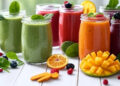 Home Detox Smoothies, Colorful assortment of home detox smoothies in glass jars with fresh fruits and vegetables